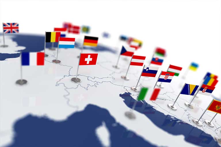 Flags on the european section of a globe.