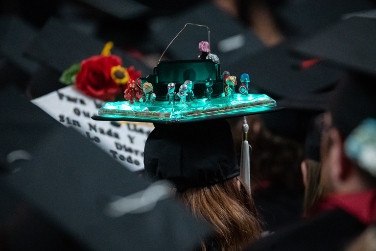 An incredibly detailed light-up graduation cap with LEGO Marvel Avengers figures