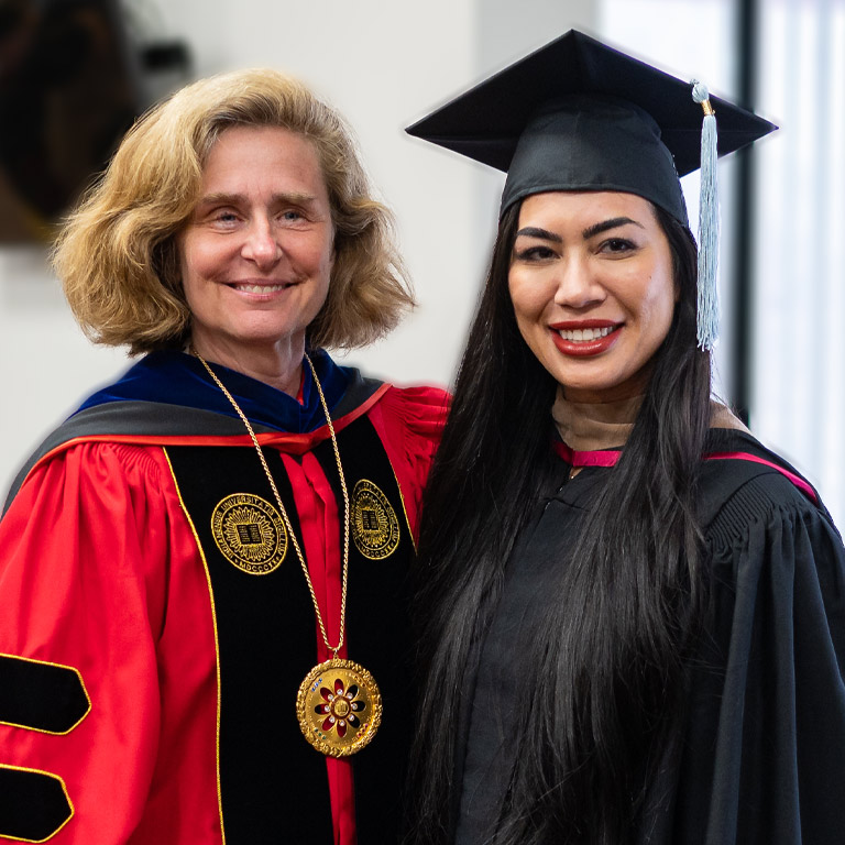 IU's president poses with an IU Northwest graduate